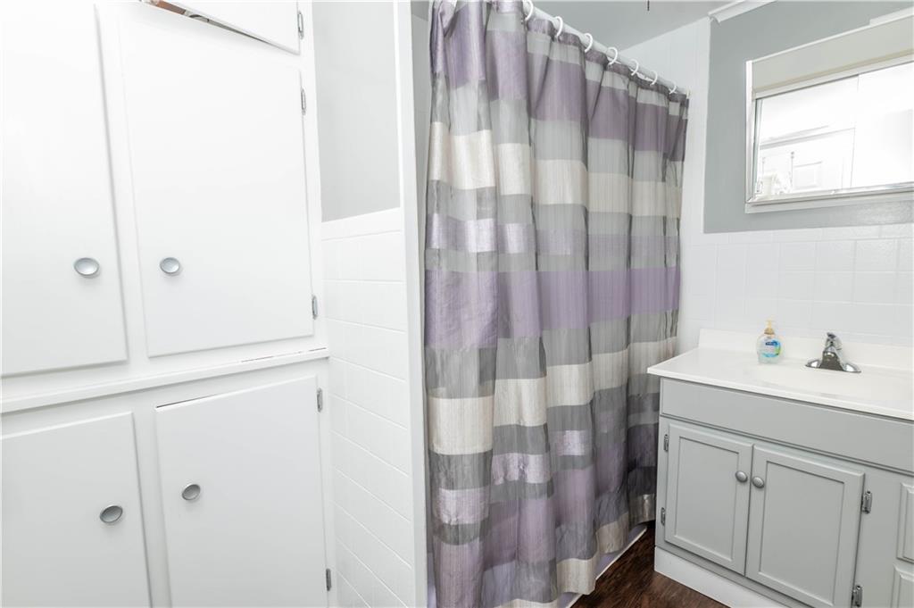 64 North Ridge Road Shelocta, PA 15774 - Photo 9 of 25 a bathroom with a sink a mirror and a shower curtain