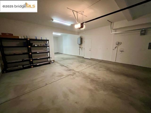 761 Stickney Way Oakley, CA 94561 - Photo 15 of 18 Garage featuring water heater and a garage door opener