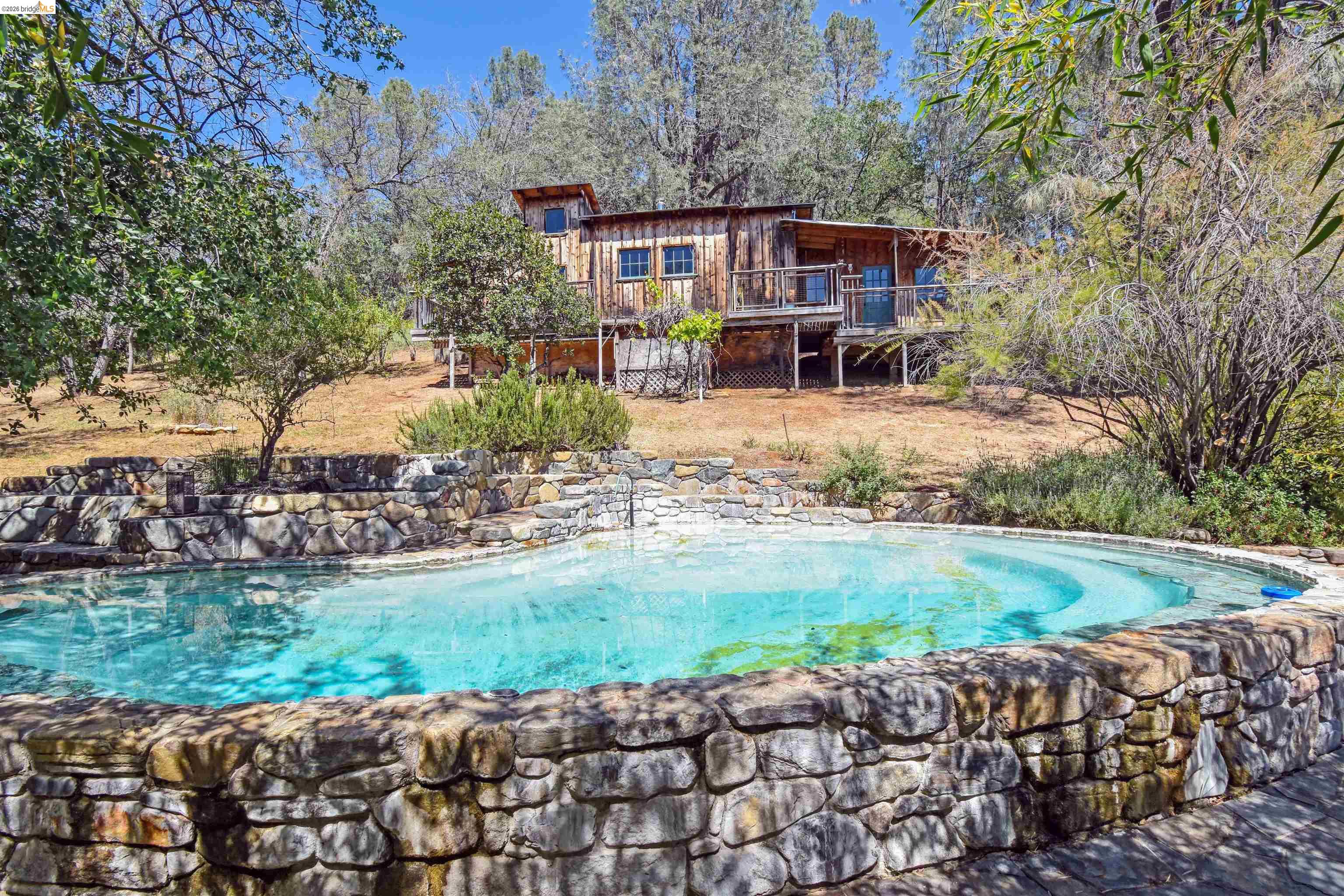 Swimming pool featuring a wooden deck