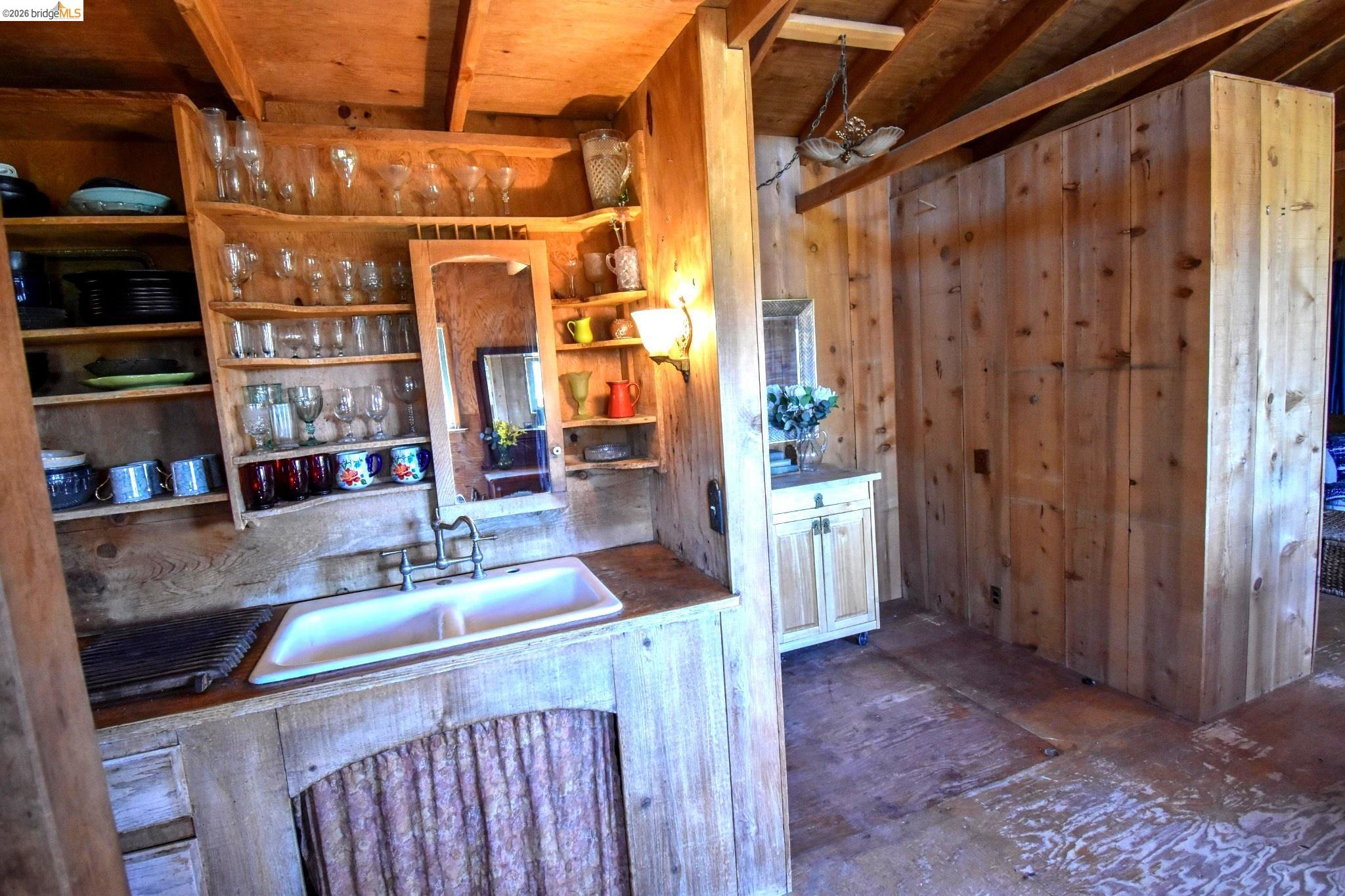 17270 Robin Ridge Road Sonora, CA 95370 - Photo 15 of 60 Kitchen featuring a sink and wooden walls