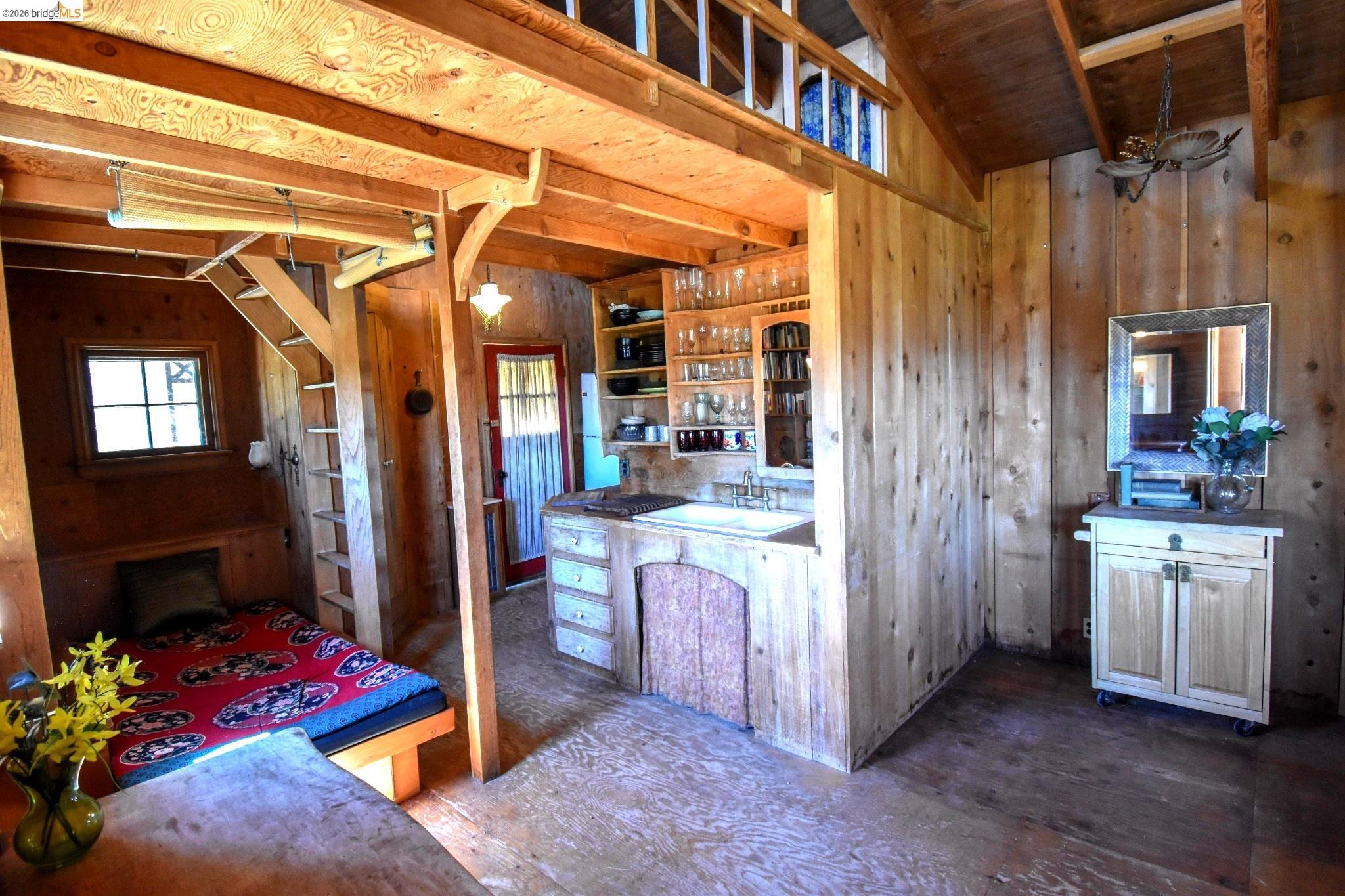 17270 Robin Ridge Road Sonora, CA 95370 - Photo 16 of 60 Kitchen with wood walls, open shelves, and a vaulted wood ceiling