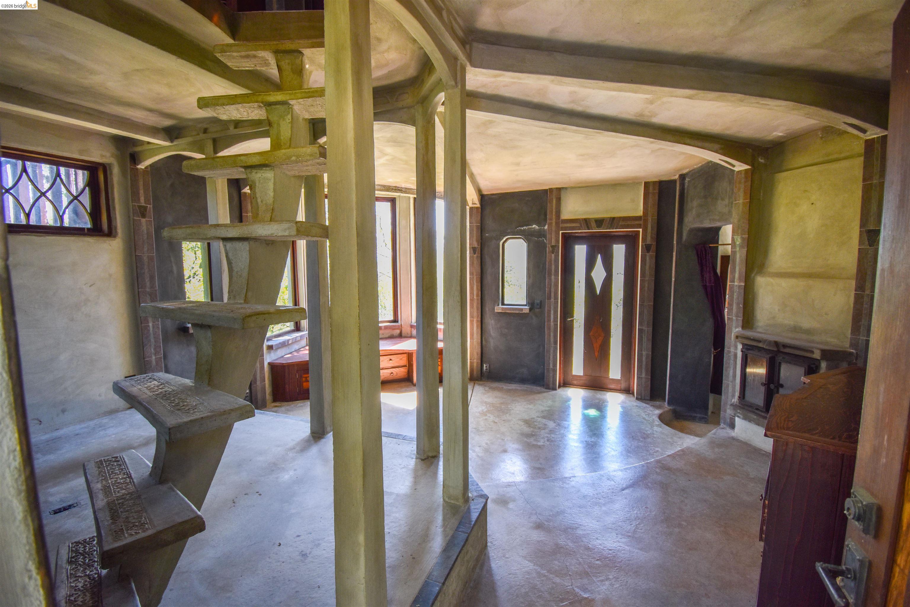 17270 Robin Ridge Road Sonora, CA 95370 - Photo 32 of 60 Entryway with arched walkways and concrete flooring