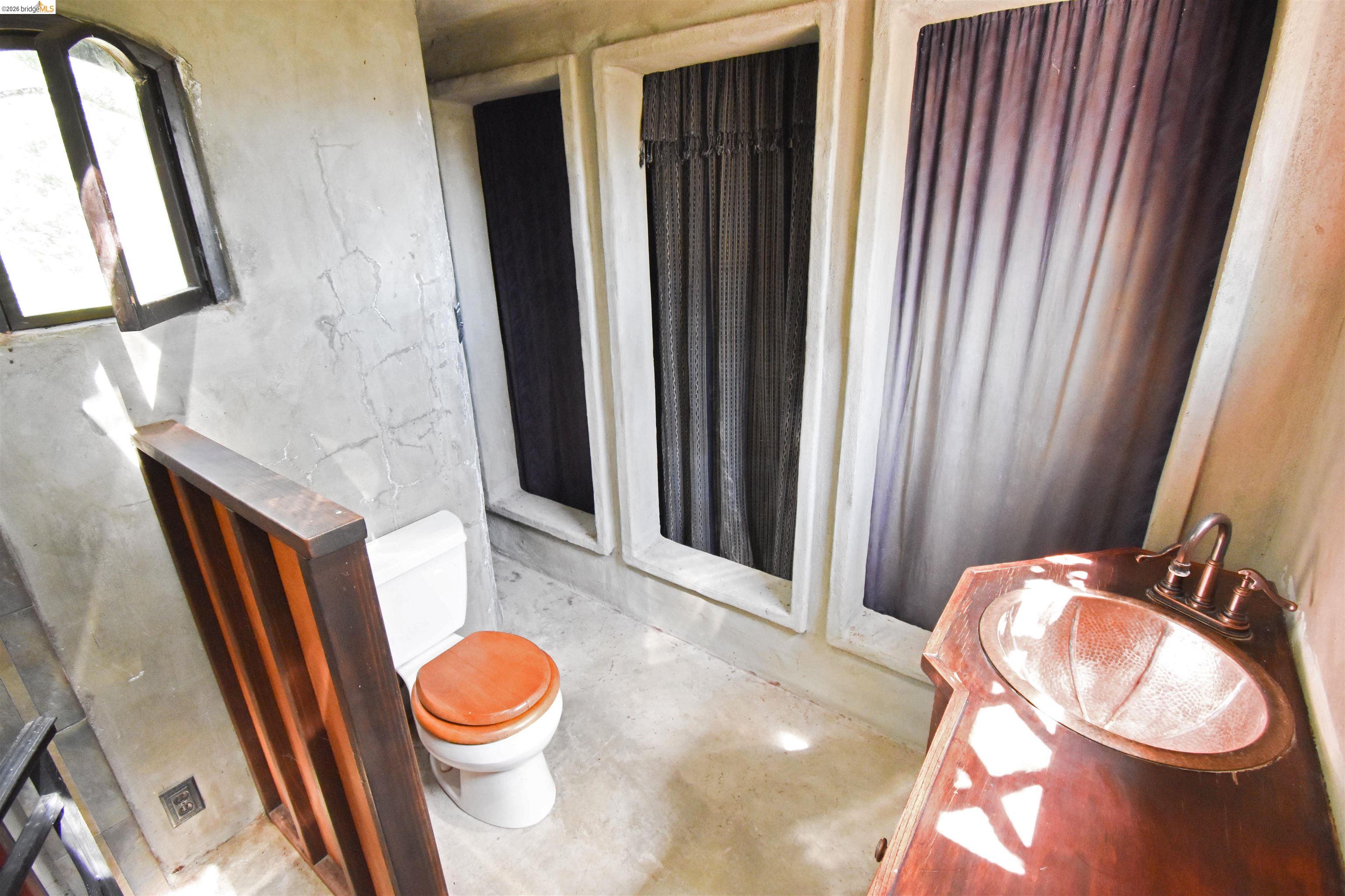 17270 Robin Ridge Road Sonora, CA 95370 - Photo 45 of 60 Bathroom with a shower stall, concrete flooring, and vanity