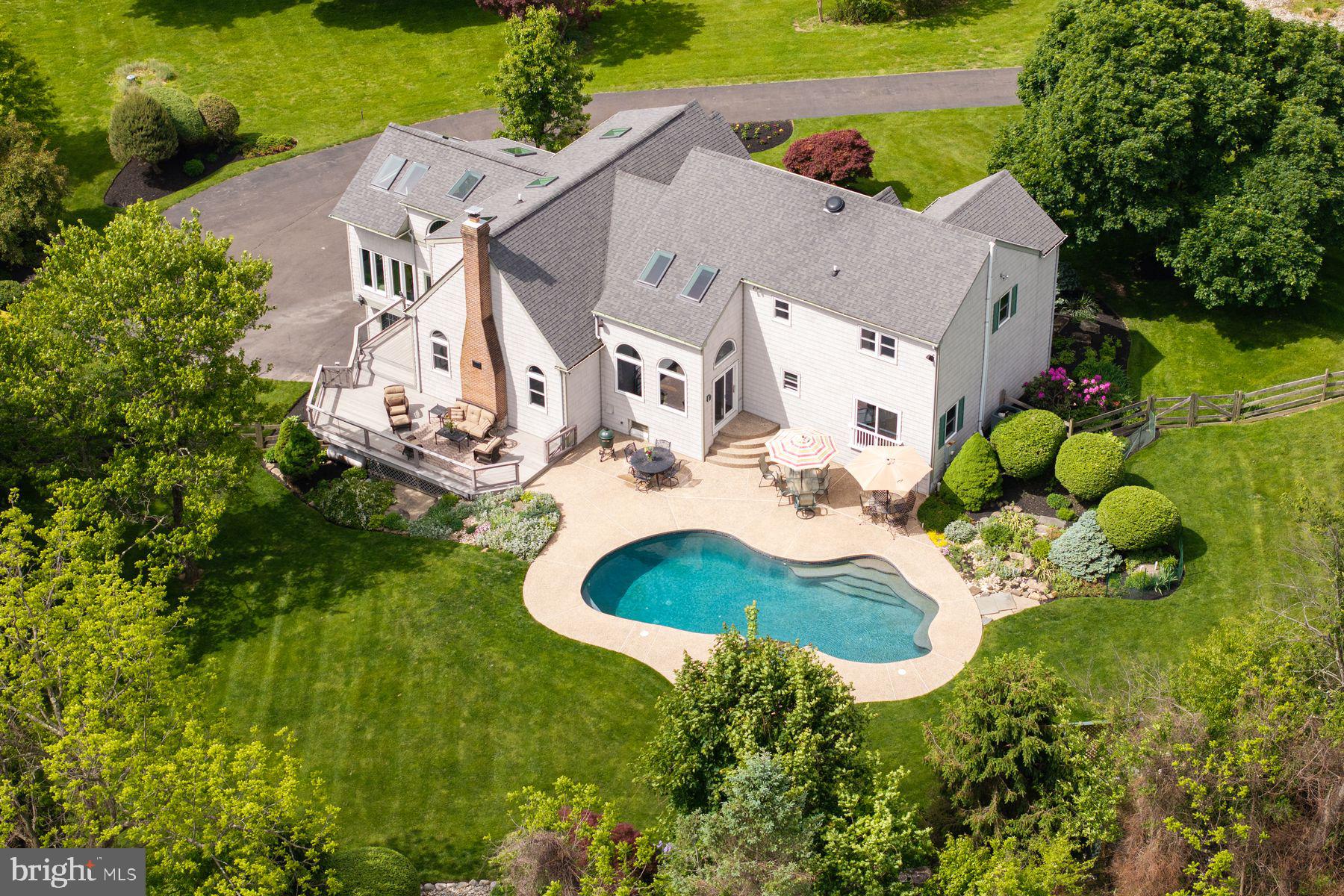 4009 Smoke Road Doylestown, PA 18902 - Photo 2 of 52 an aerial view of a house with a swimming pool and garden