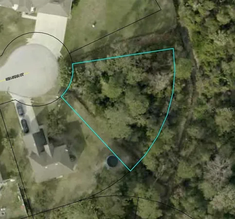 an aerial view of a highlighted house