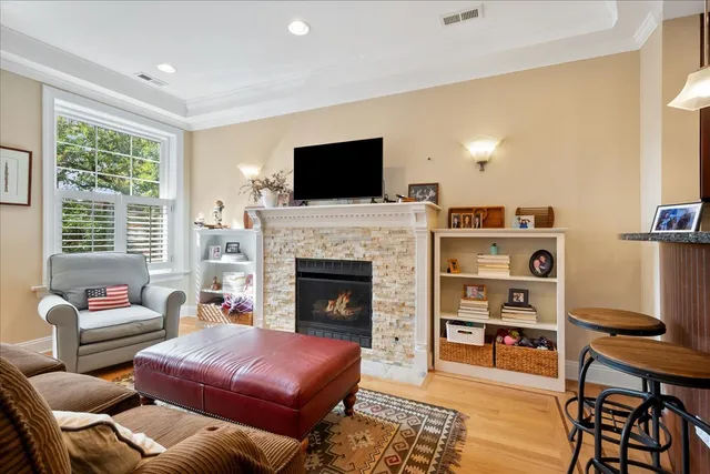 a living room with furniture and a fireplace