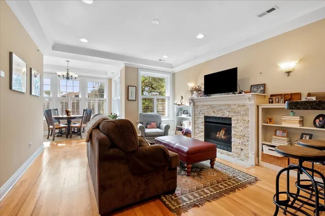 a view of a dining room with furniture windows and wooden floor