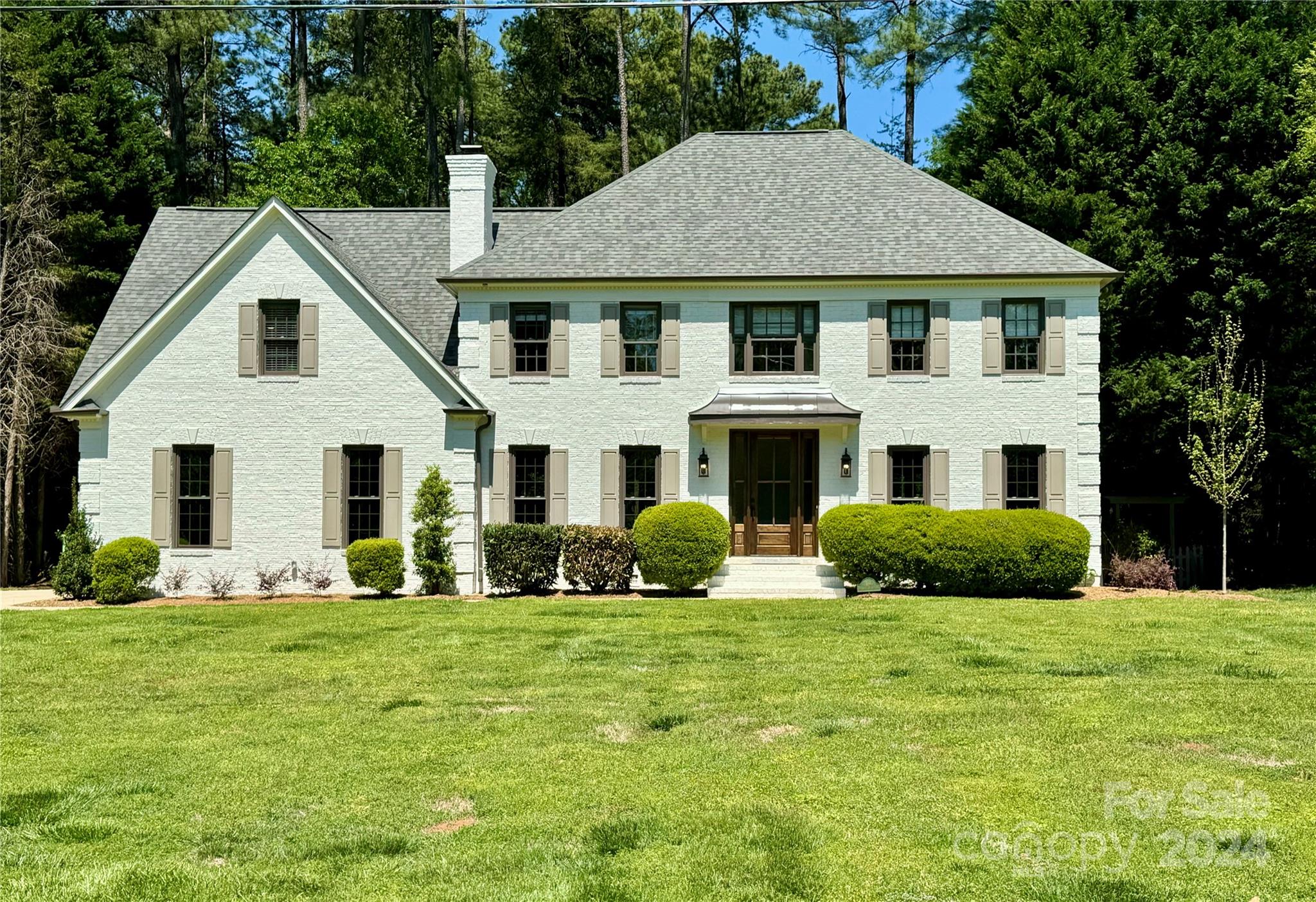 21140 Bethel Church Road Cornelius, NC 28031 - Photo 1 of 48 a aerial view of a white house