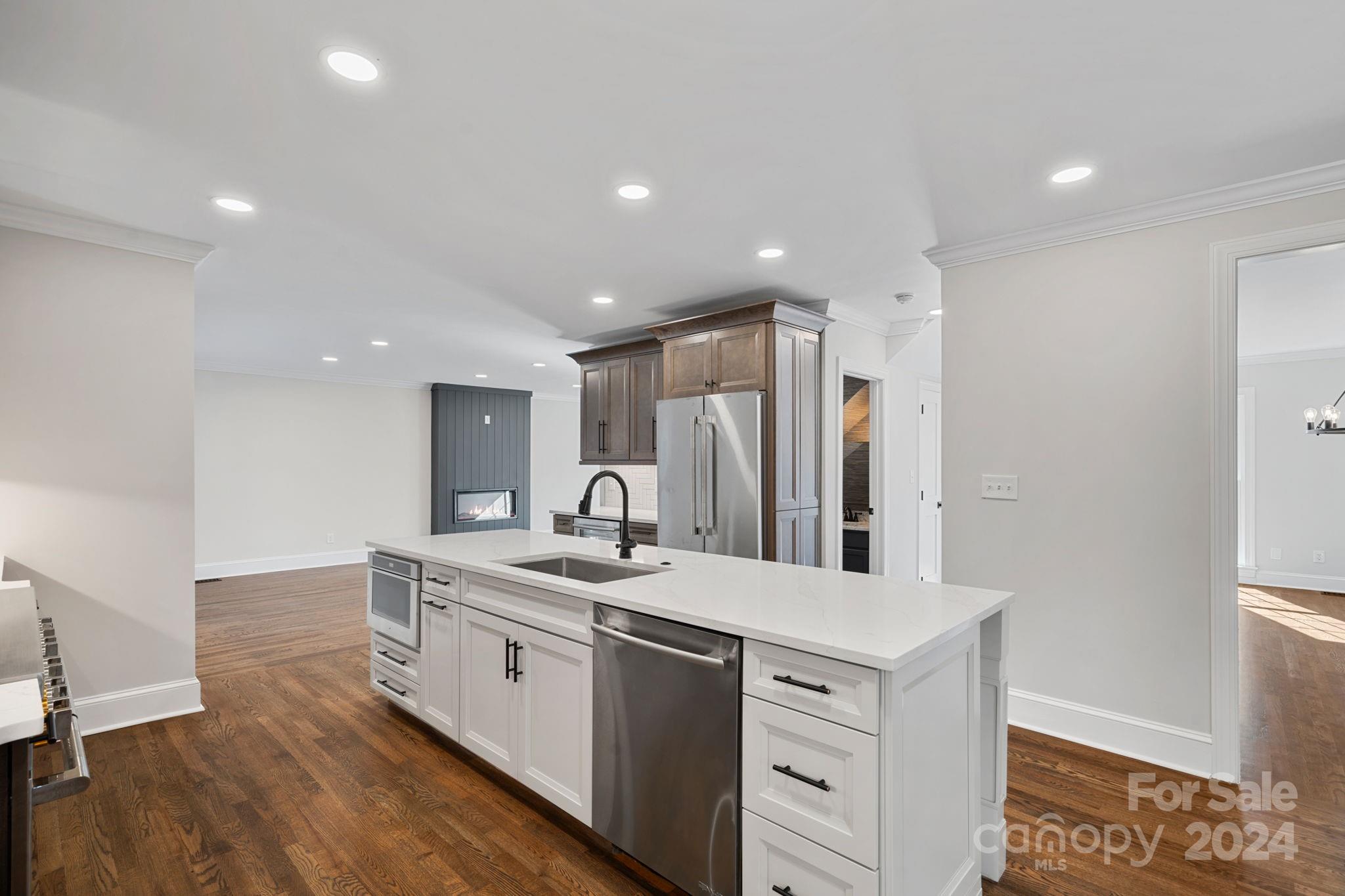 21140 Bethel Church Road Cornelius, NC 28031 - Photo 12 of 48 a kitchen with a sink stove and refrigerator
