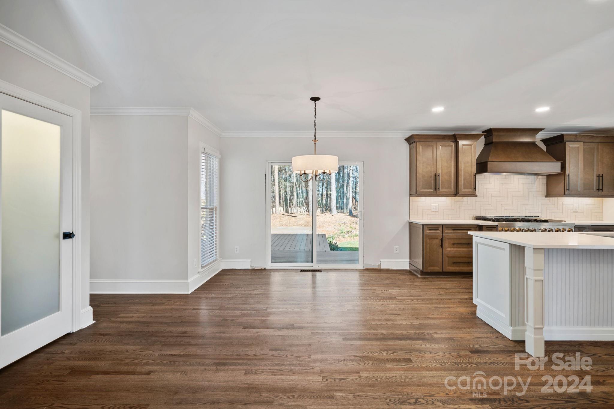 21140 Bethel Church Road Cornelius, NC 28031 - Photo 14 of 48 a view of kitchen with granite countertop cabinets and refrigerator