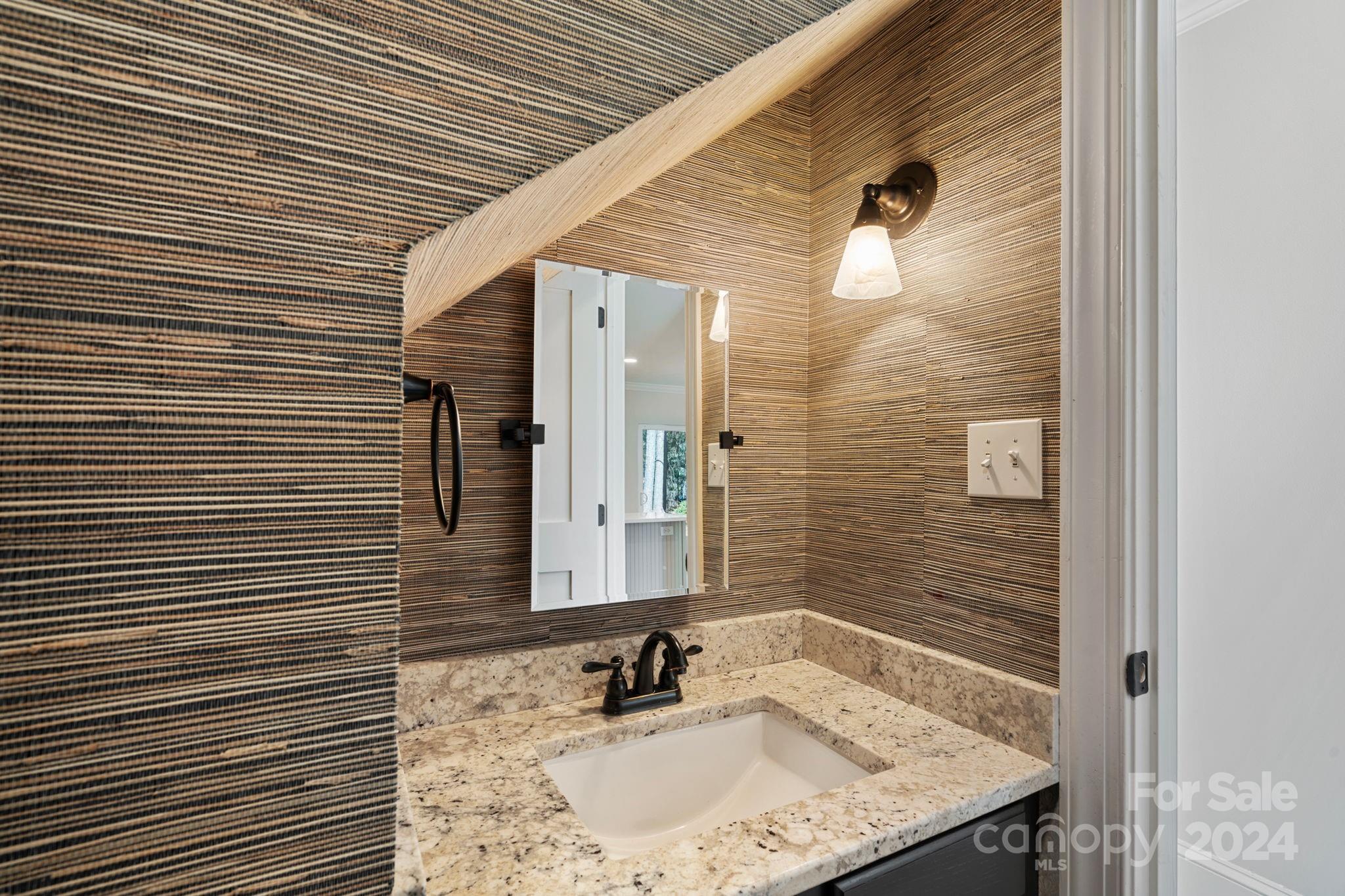 21140 Bethel Church Road Cornelius, NC 28031 - Photo 17 of 48 a bathroom with a granite countertop shower and a sink