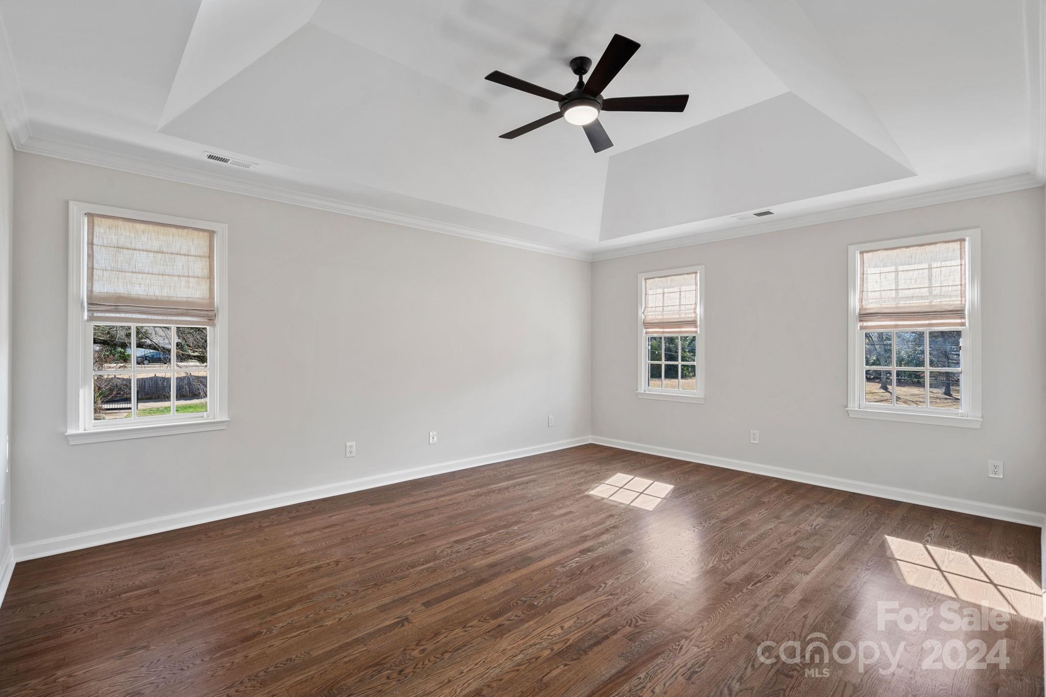 21140 Bethel Church Road Cornelius, NC 28031 - Photo 18 of 48 a view of a big room with wooden floor and windows