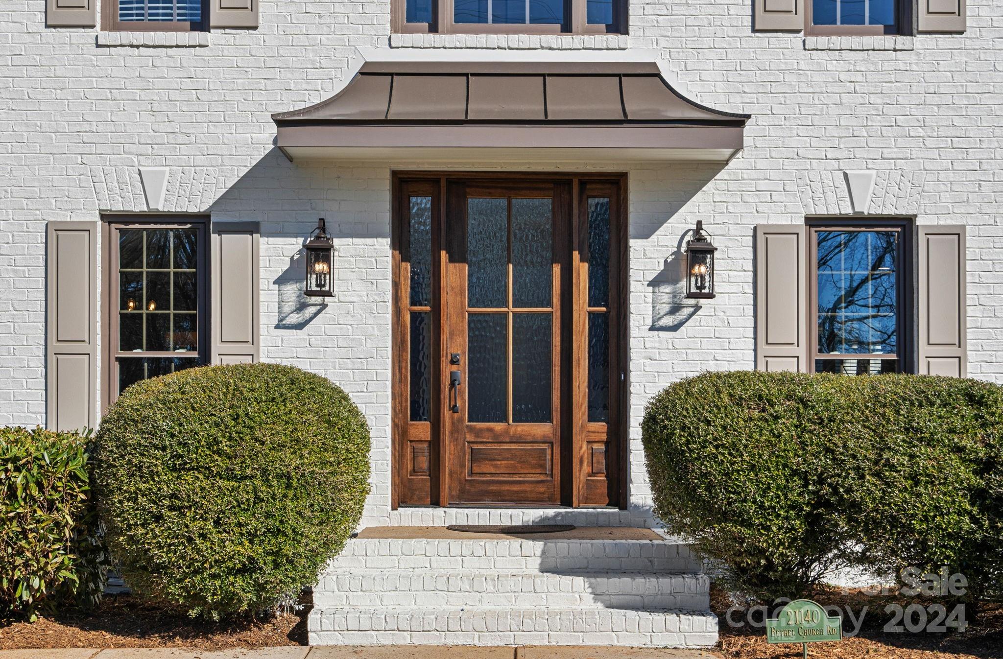 21140 Bethel Church Road Cornelius, NC 28031 - Photo 2 of 48 a front view of a house
