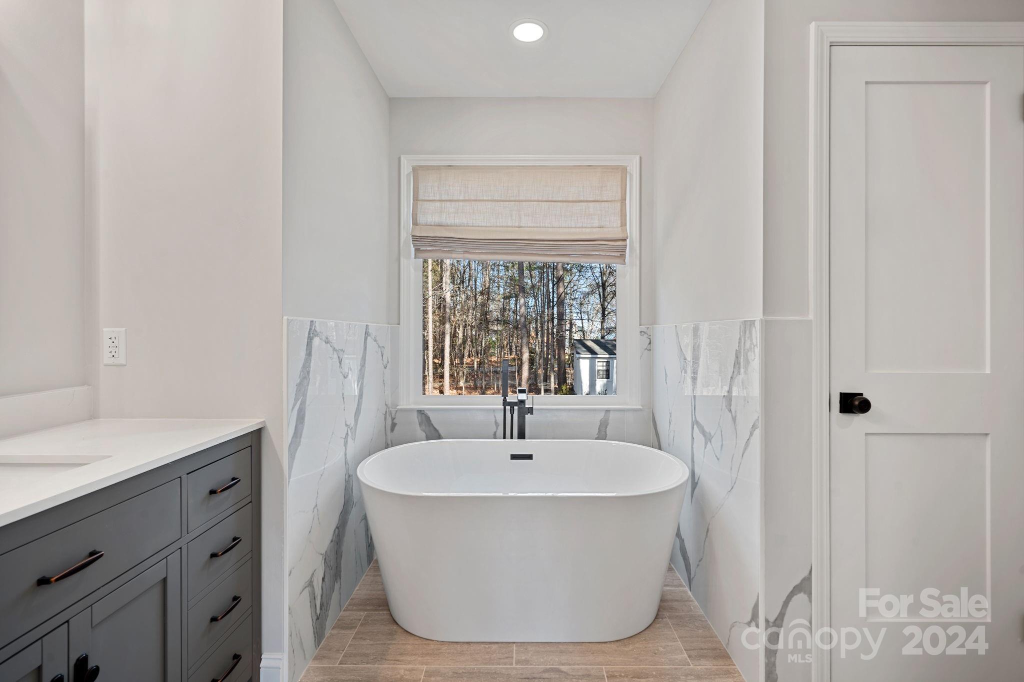 21140 Bethel Church Road Cornelius, NC 28031 - Photo 21 of 48 a bathroom with a sink and a mirror