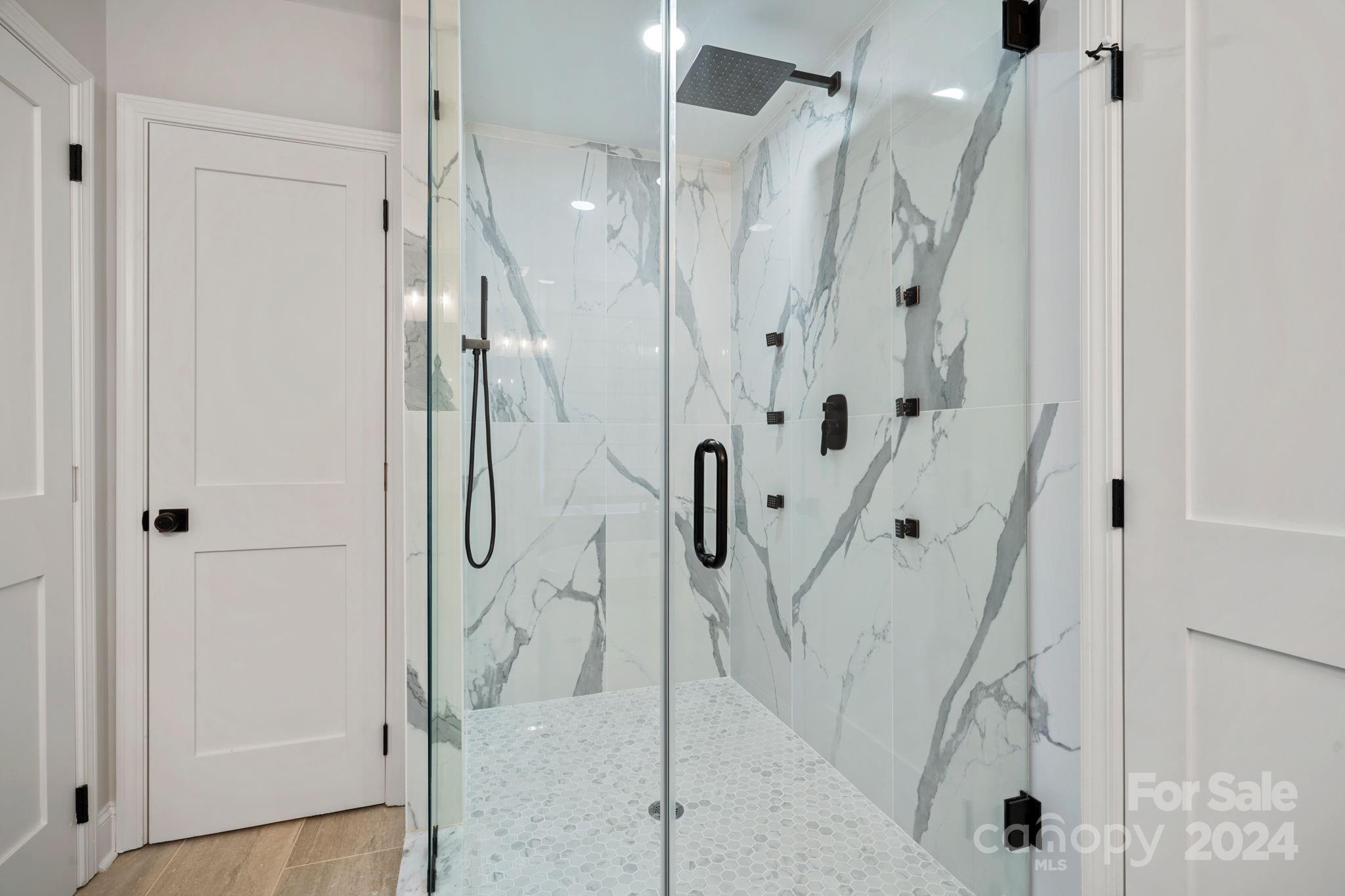 21140 Bethel Church Road Cornelius, NC 28031 - Photo 22 of 48 a bathroom with a shower