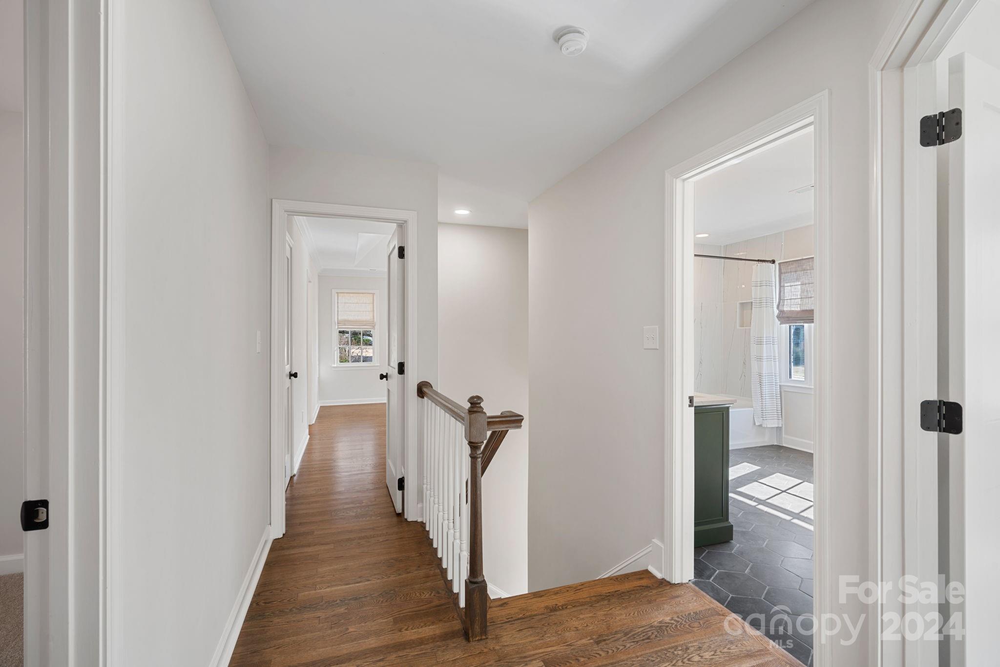 21140 Bethel Church Road Cornelius, NC 28031 - Photo 23 of 48 a view of hallway with wooden floor