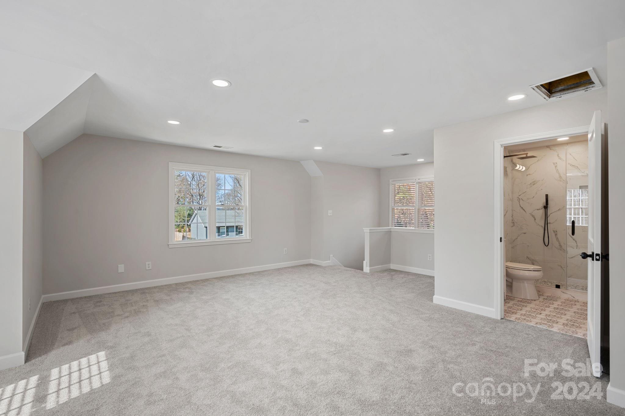 21140 Bethel Church Road Cornelius, NC 28031 - Photo 31 of 48 an empty room with a bathroom and a shower