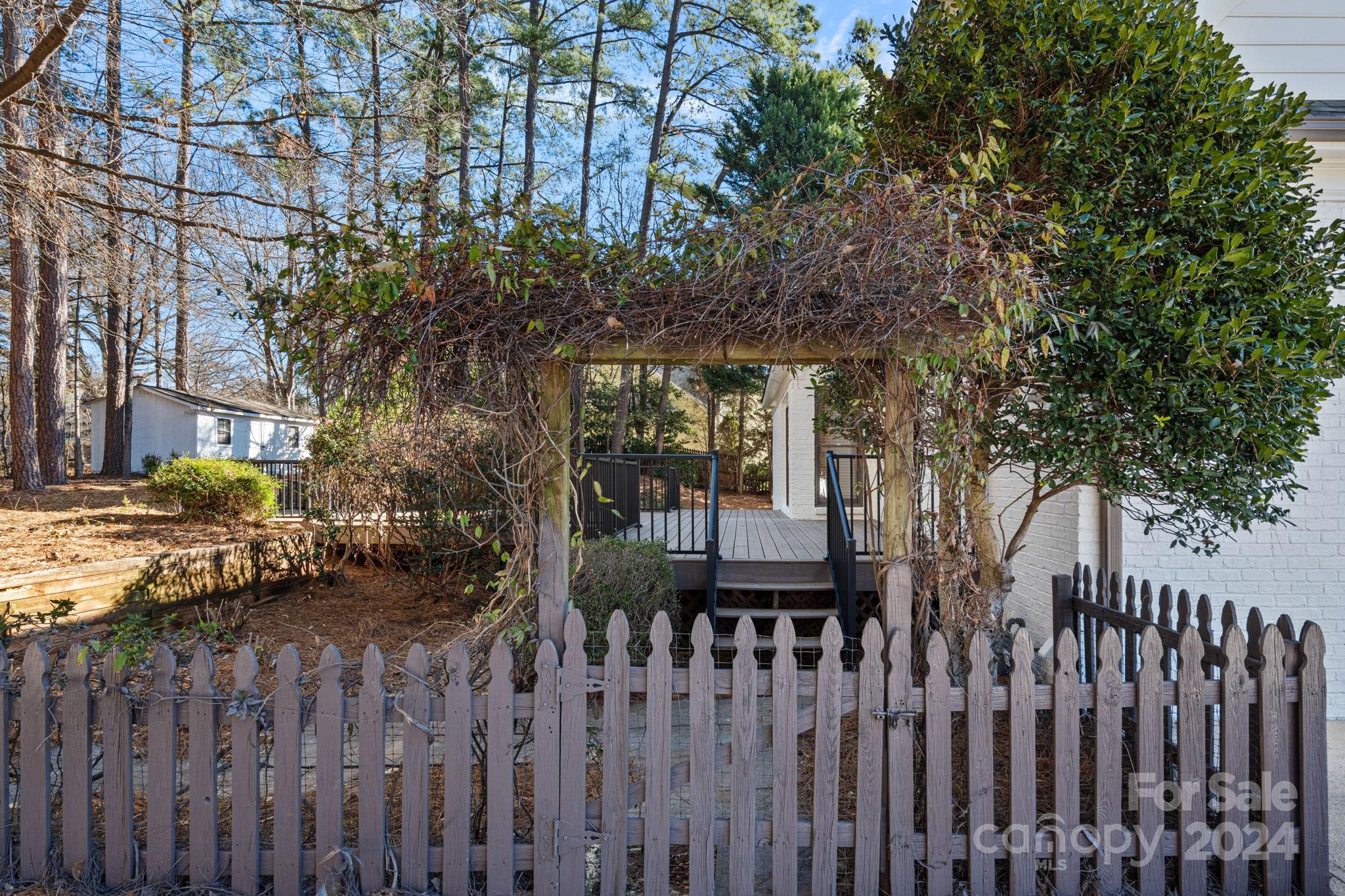 21140 Bethel Church Road Cornelius, NC 28031 - Photo 33 of 48 a front view of a house with a garden