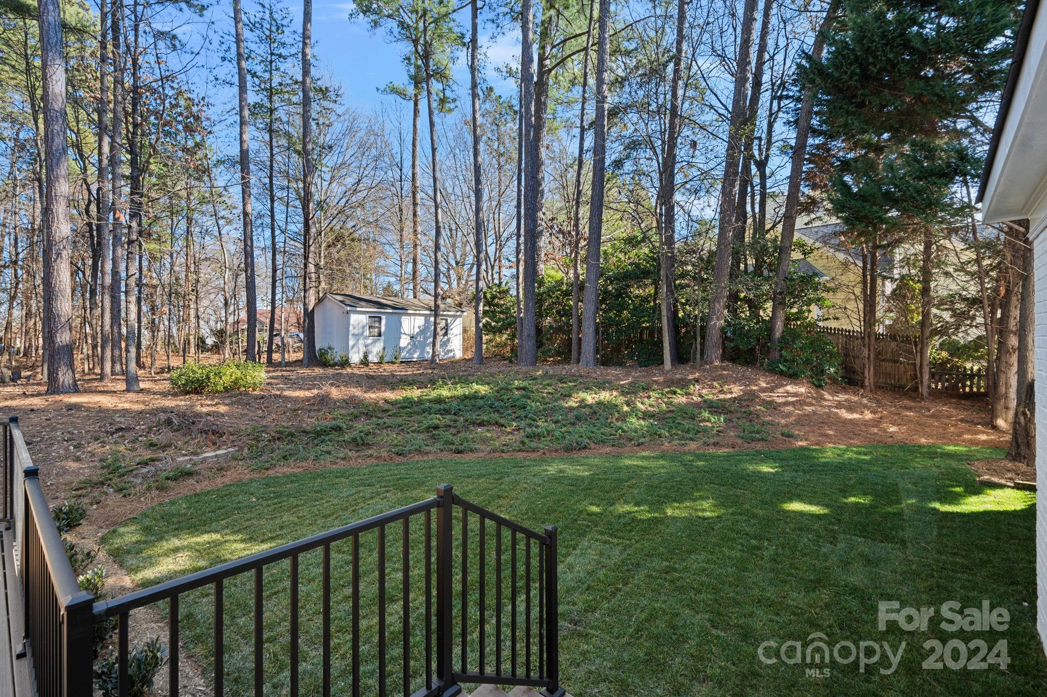21140 Bethel Church Road Cornelius, NC 28031 - Photo 35 of 48 a view of a backyard with large trees