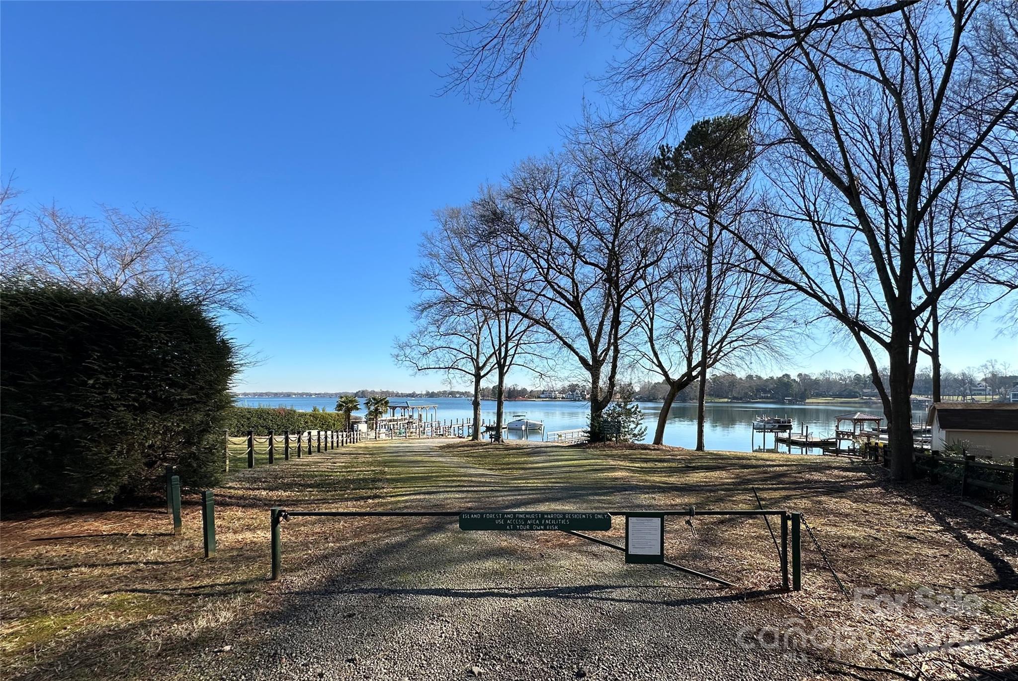 21140 Bethel Church Road Cornelius, NC 28031 - Photo 47 of 48 a swimming pool with outdoor seating and trees