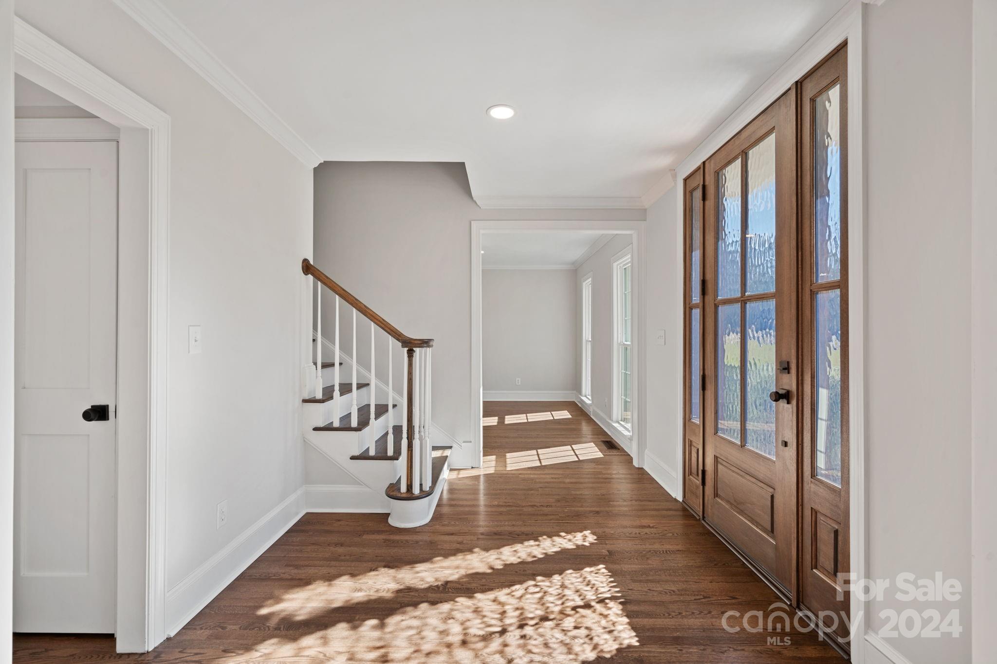 21140 Bethel Church Road Cornelius, NC 28031 - Photo 5 of 48 a view of an entryway with wooden floor