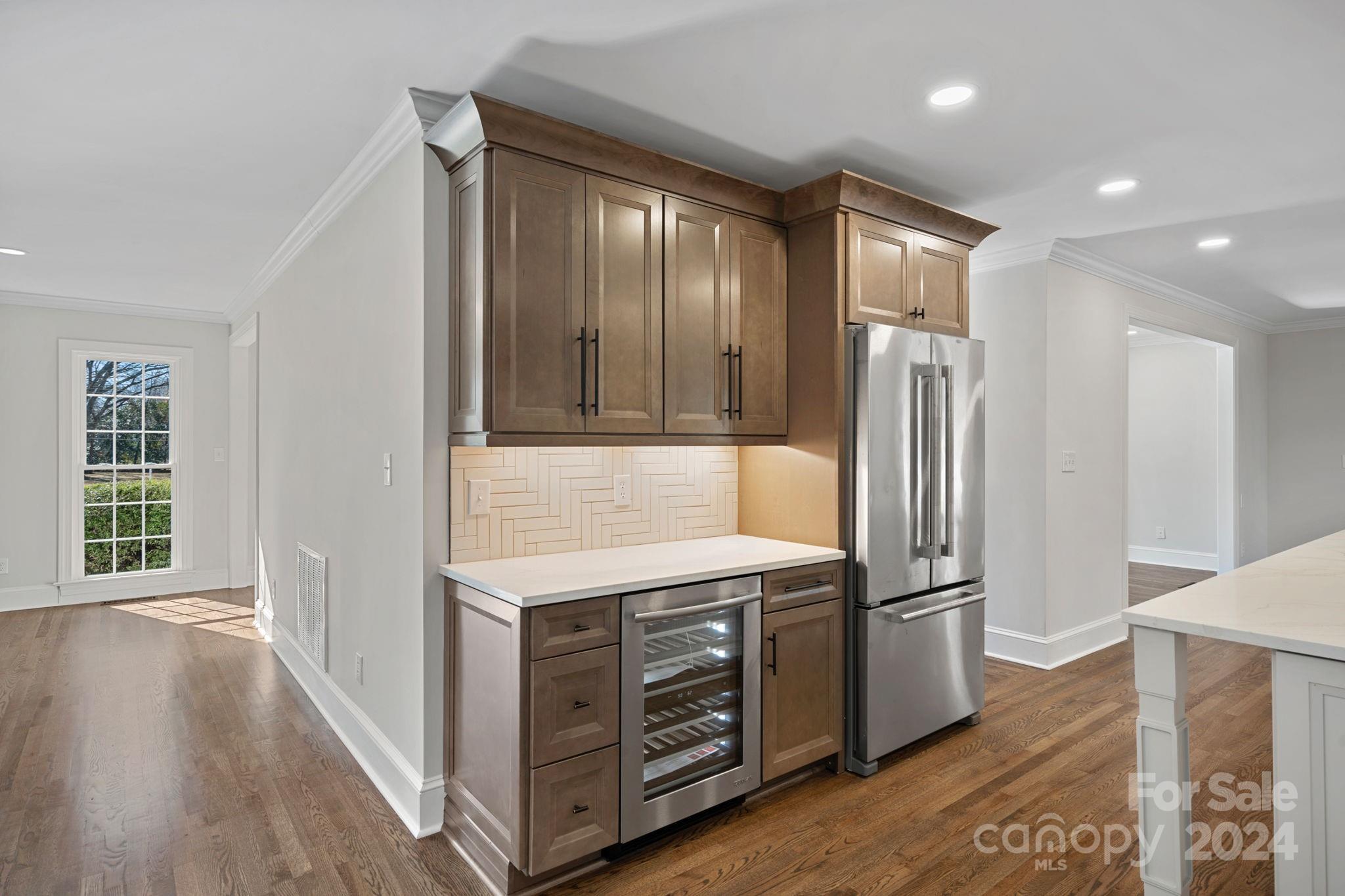 21140 Bethel Church Road Cornelius, NC 28031 - Photo 9 of 48 a kitchen with a refrigerator and a sink