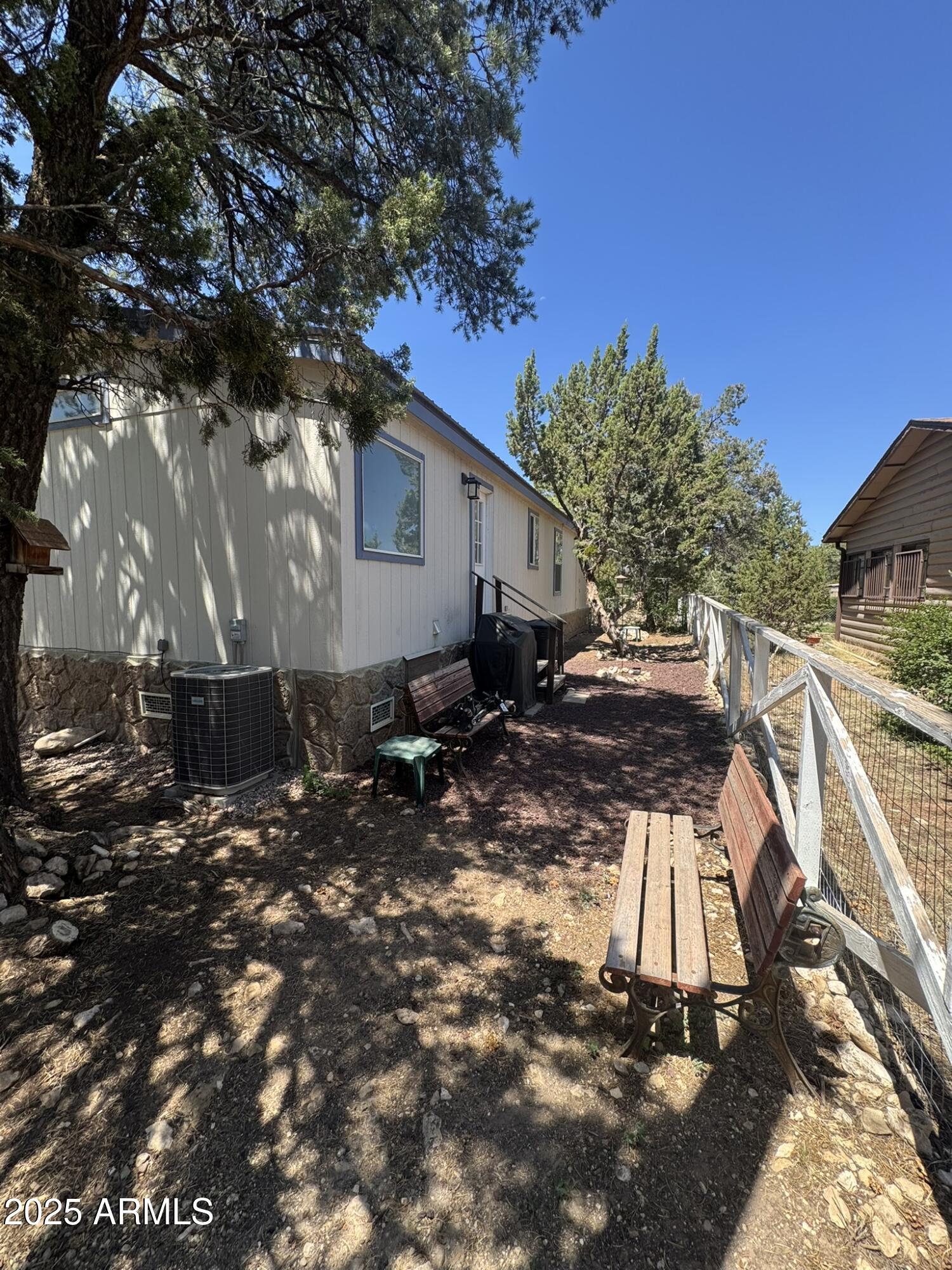 1998 Stagg Run Overgaard, AZ 85933 - Photo 14 of 61 a view of backyard with a table and chairs under an umbrella