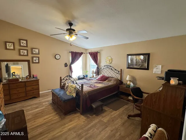 a living room with furniture and a mirror