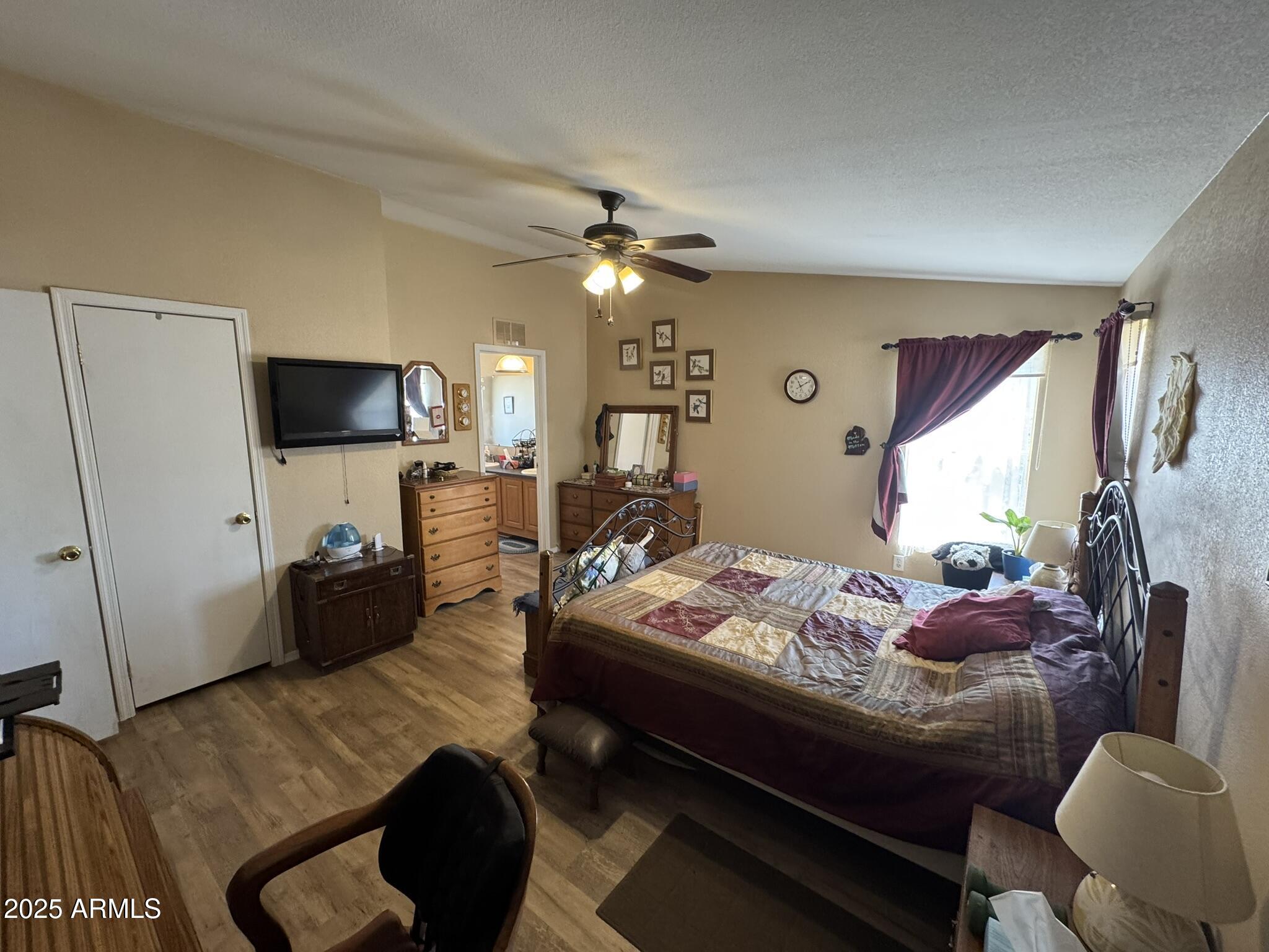 1998 Stagg Run Overgaard, AZ 85933 - Photo 27 of 61 a bedroom with furniture and a flat screen tv
