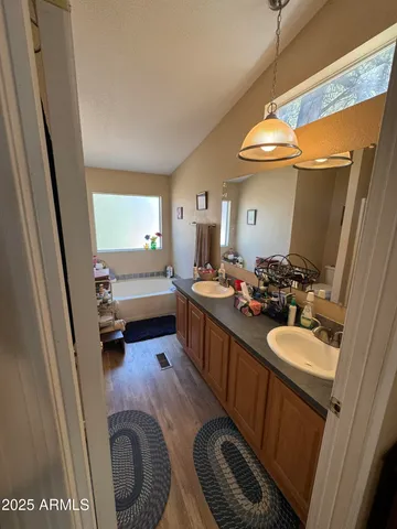 a bedroom with furniture and a flat screen tv