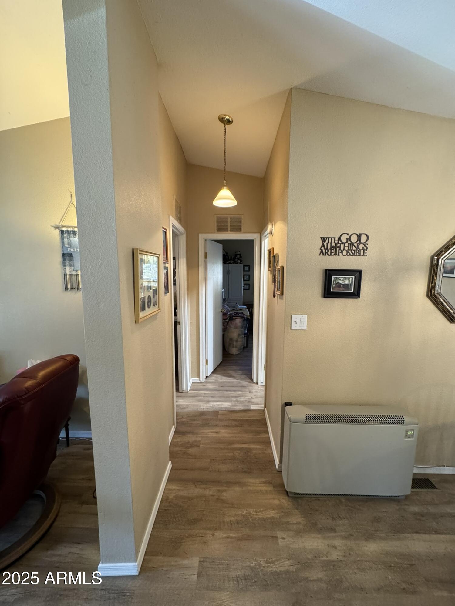 1998 Stagg Run Overgaard, AZ 85933 - Photo 35 of 61 a view of a hallway with wooden floor and staircase