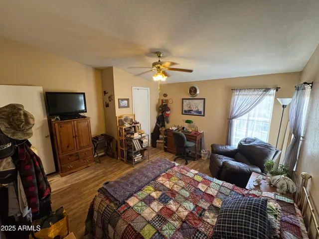 a bed room with furniture and a window