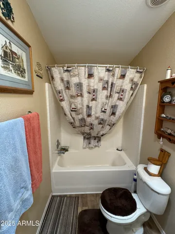 a view of a dining room with furniture and a flat screen tv