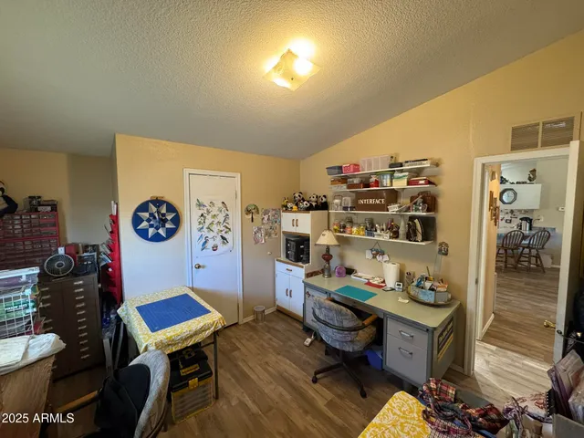 a kitchen with stainless steel appliances granite countertop a refrigerator sink and white cabinets