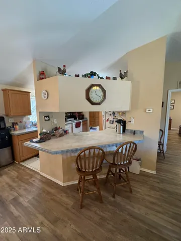 a kitchen with stainless steel appliances a refrigerator and cabinets