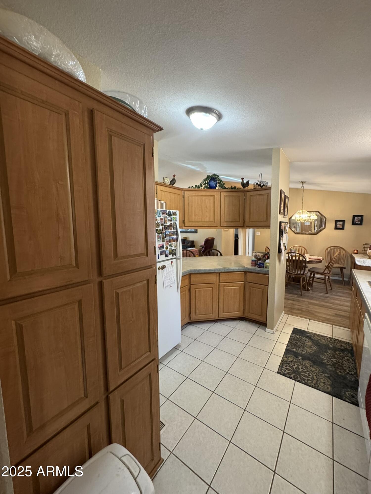 1998 Stagg Run Overgaard, AZ 85933 - Photo 56 of 61 a kitchen with stainless steel appliances granite countertop a refrigerator sink and white cabinets