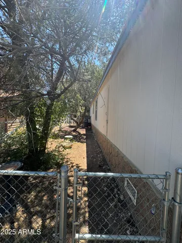 a view of a house with a tree in the background