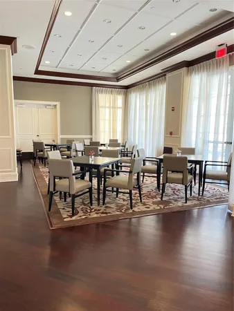 a dining hall with lots of table and chairs