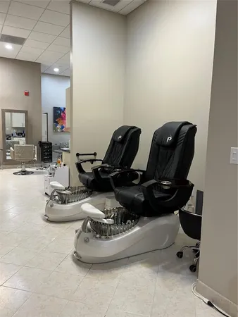 a room with a couch and a potted plant