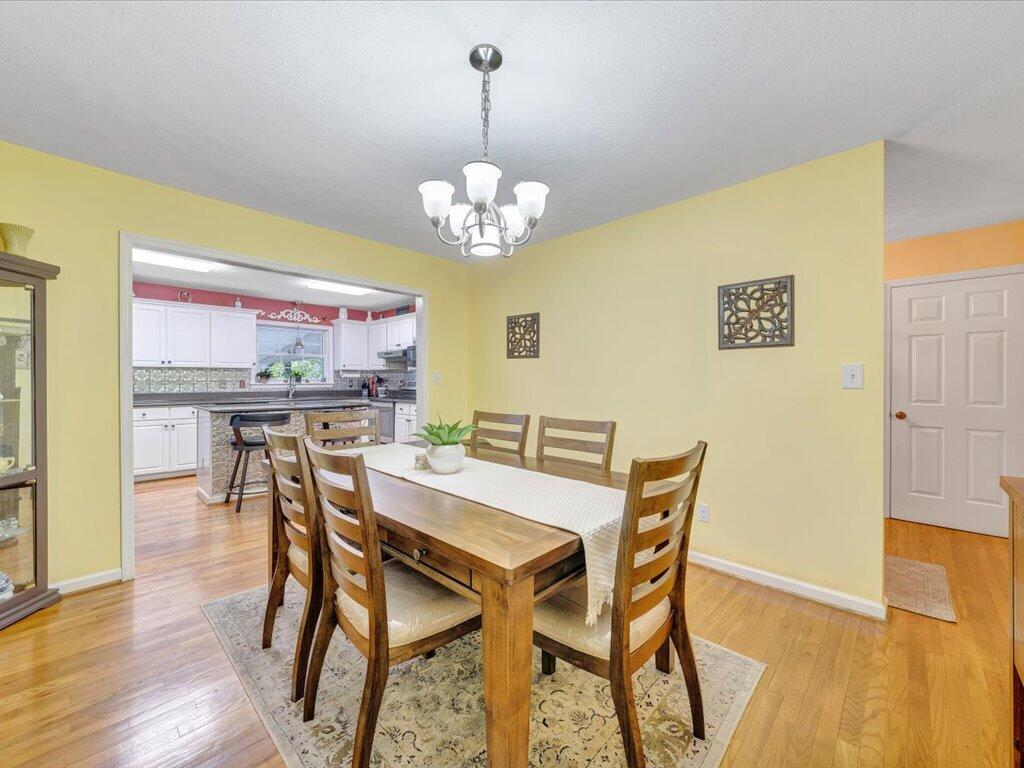 3475 Blue Knob Road Martinsville, VA 24112 - Photo 12 of 80 a view of a dining room with furniture and wooden floor