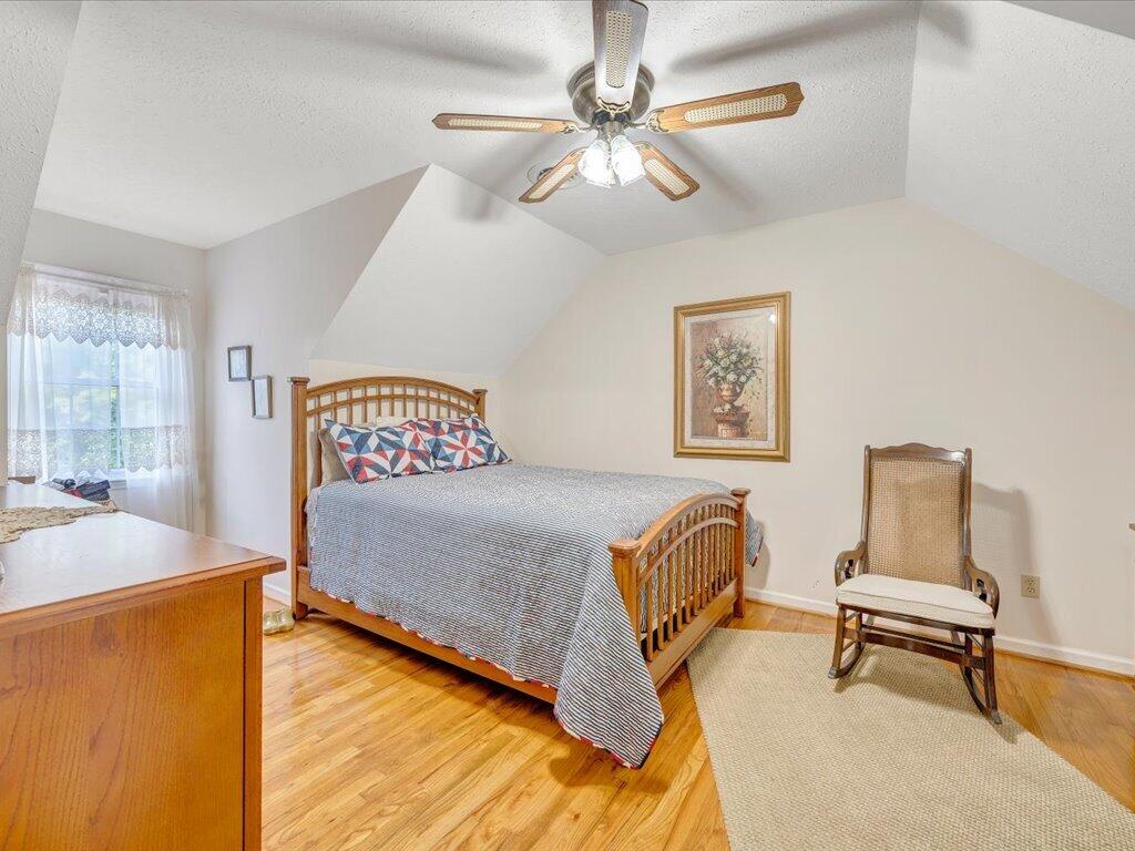 3475 Blue Knob Road Martinsville, VA 24112 - Photo 28 of 80 a bedroom with a bed and a chandelier