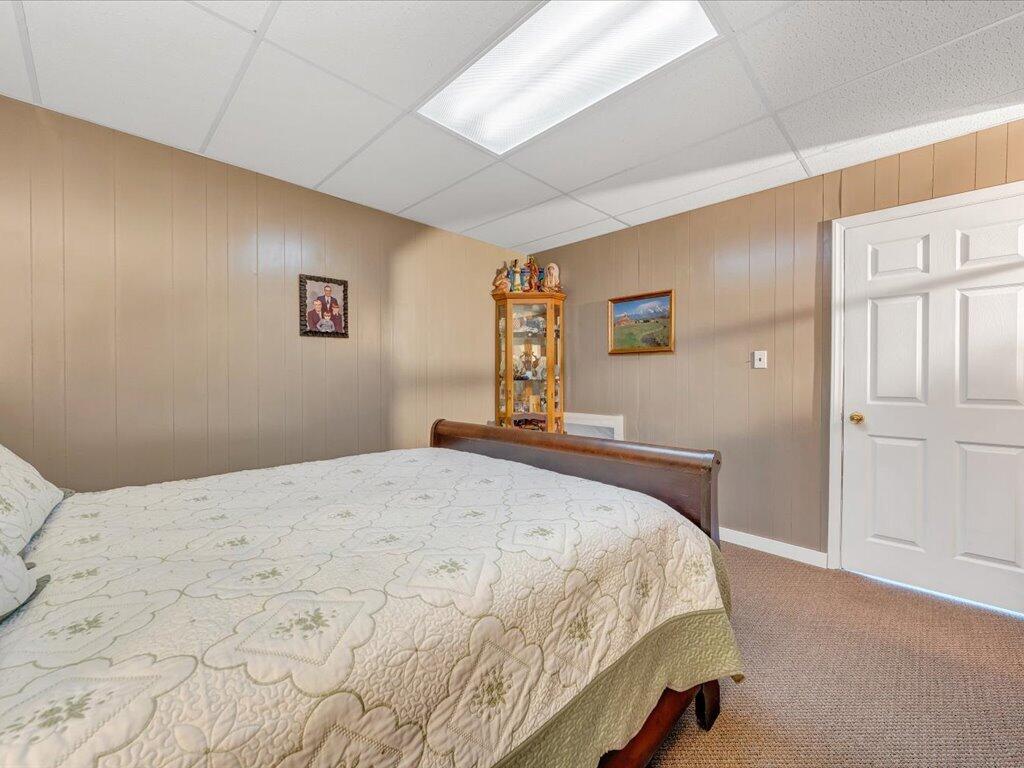 3475 Blue Knob Road Martinsville, VA 24112 - Photo 34 of 80 a bedroom with a bed and painting on the wall