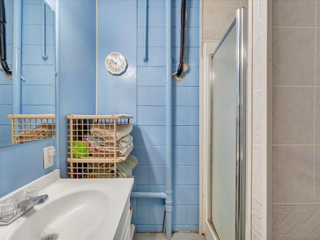3475 Blue Knob Road Martinsville, VA 24112 - Photo 35 of 80 a bathroom with a sink and a shower