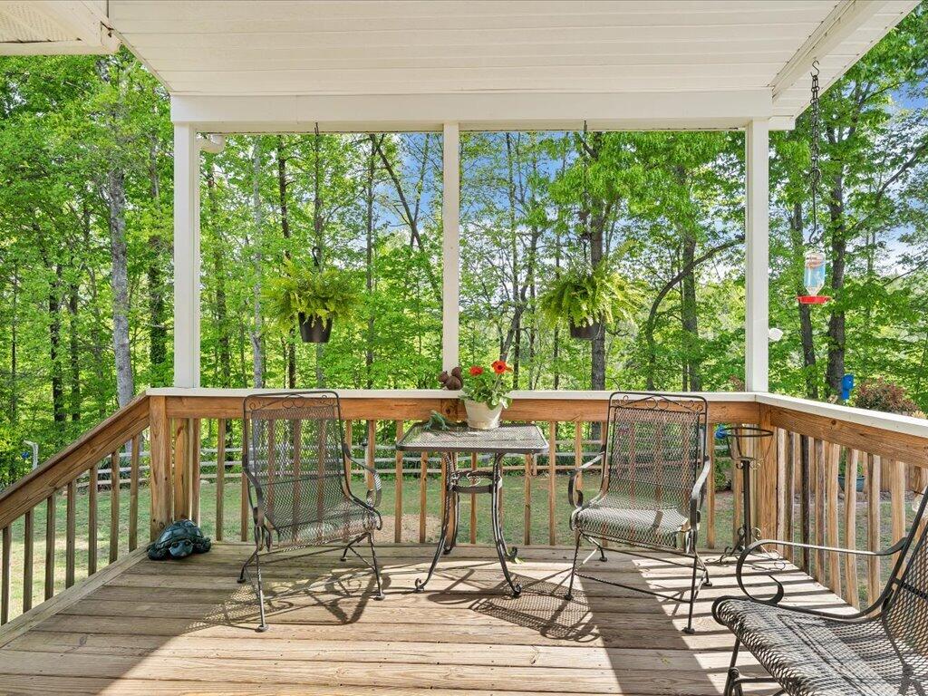 3475 Blue Knob Road Martinsville, VA 24112 - Photo 41 of 80 a view of balcony with wooden floor and outdoor seating