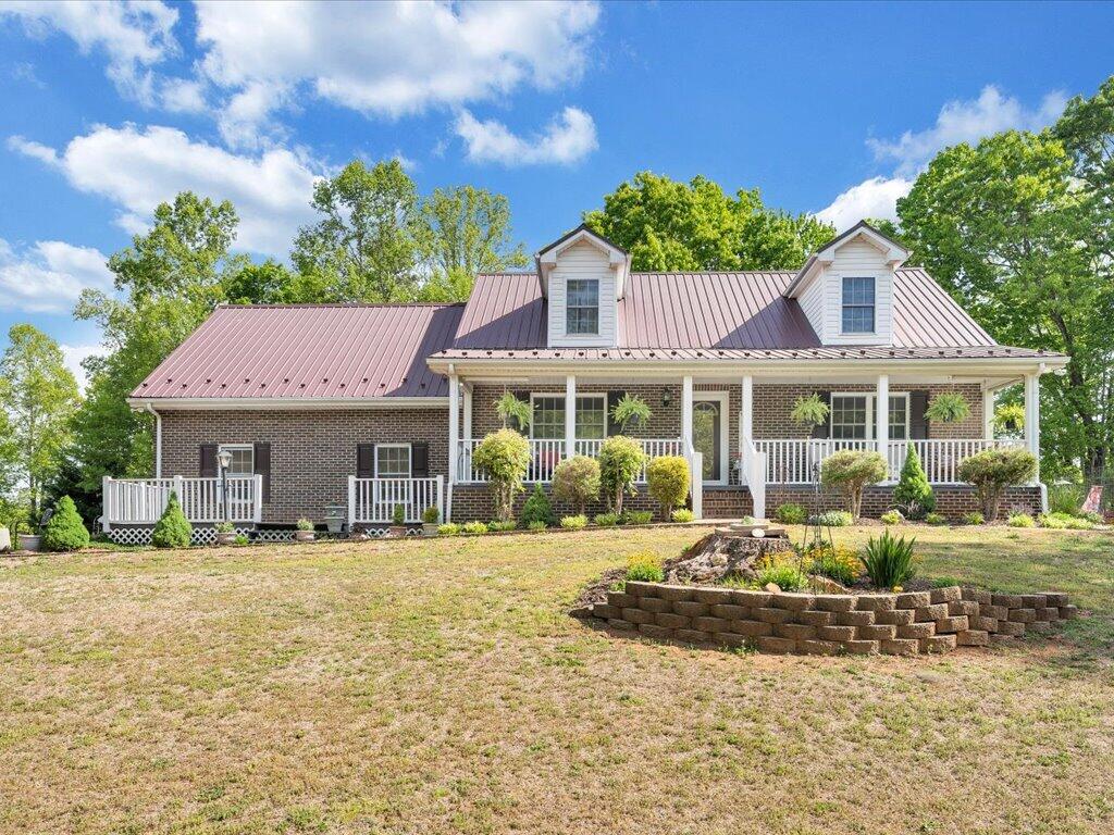 3475 Blue Knob Road Martinsville, VA 24112 - Photo 57 of 80 a front view of a house with a yard table and chairs