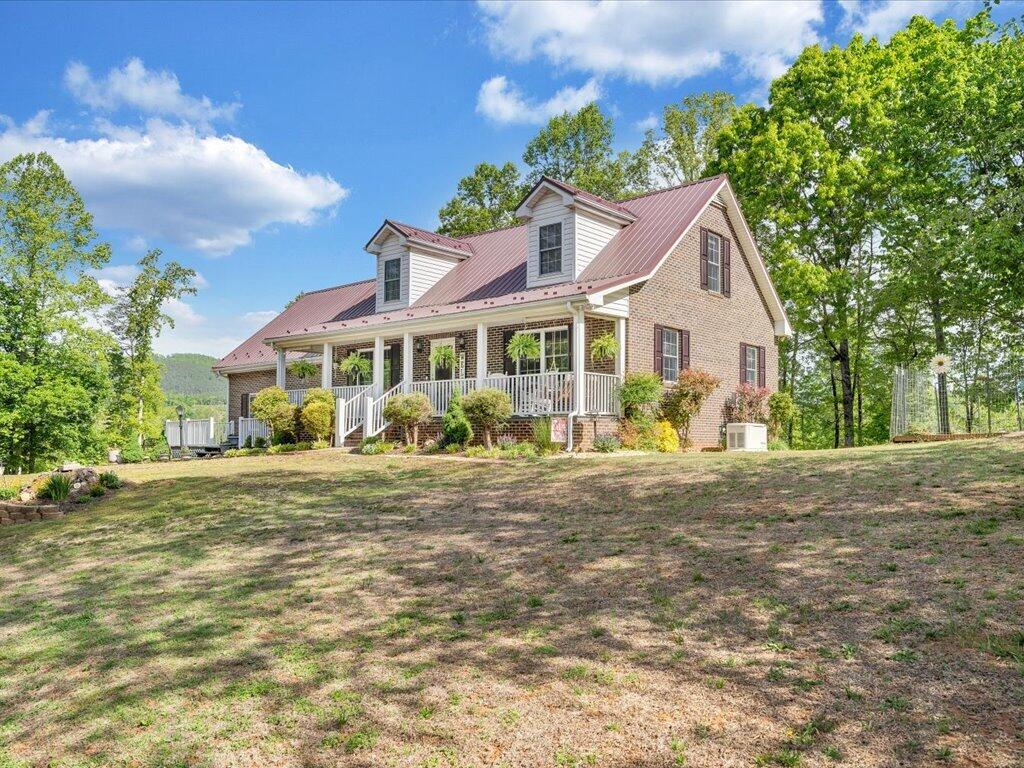 3475 Blue Knob Road Martinsville, VA 24112 - Photo 59 of 80 a front view of a house with a garden and trees