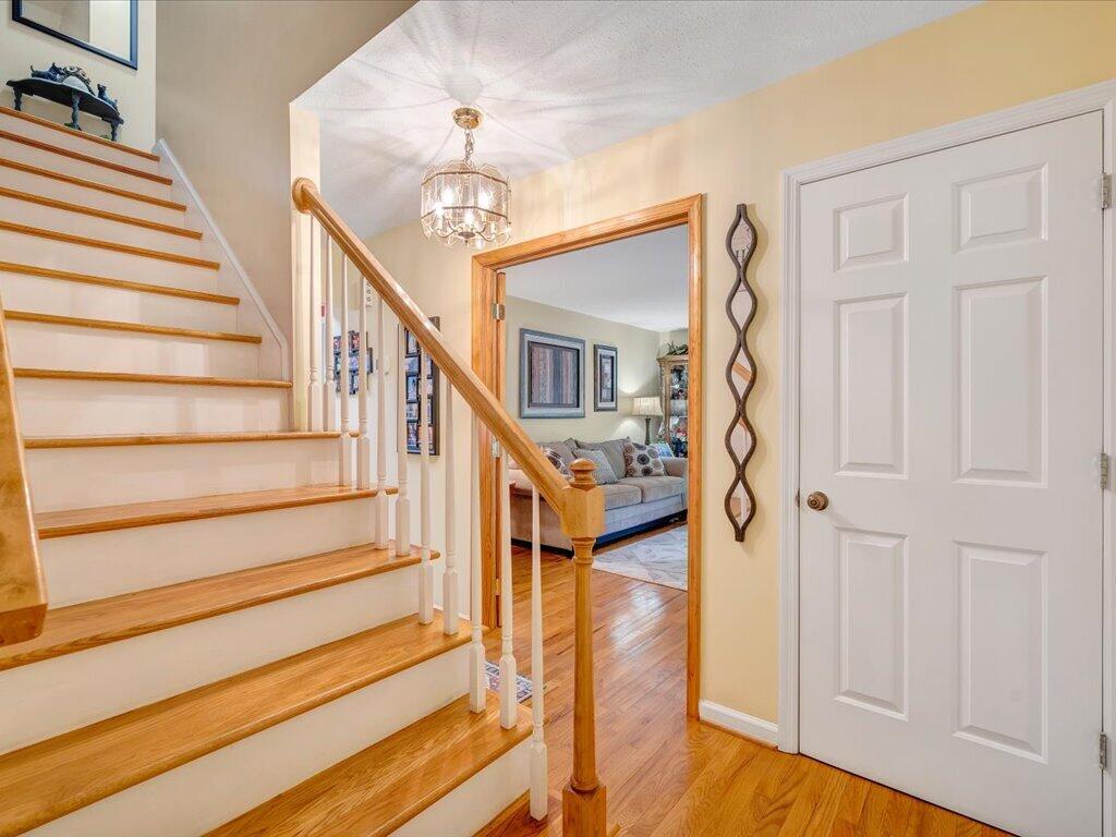 3475 Blue Knob Road Martinsville, VA 24112 - Photo 8 of 80 a view of staircase with white walls and wooden floor