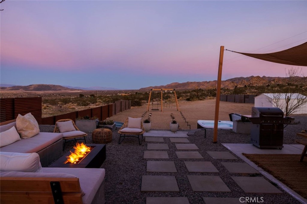 6979 White Feather Road Joshua Tree, CA 92252 - Photo 11 of 44 a terrace with outdoor seating and city view