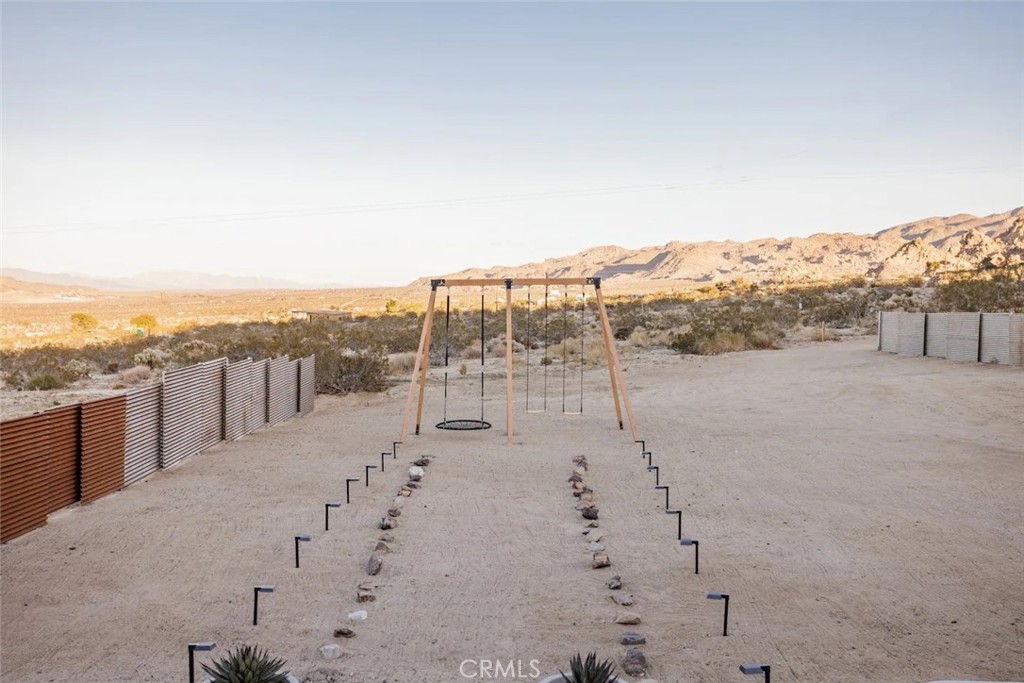 6979 White Feather Road Joshua Tree, CA 92252 - Photo 14 of 44 a view of a terrace with skyline