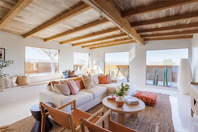 a living room with furniture and a rug